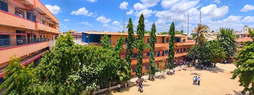 Panoramic view of Santosh Group courtyard, academic buildings, and campus trees